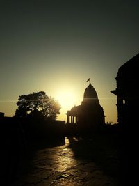 Silhouette of temple at sunset