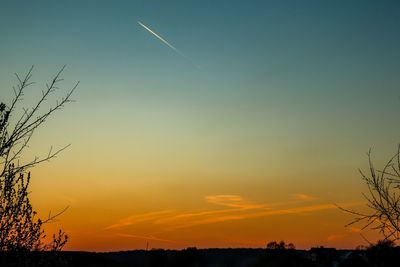 Low angle view of silhouette landscape against sky during sunset