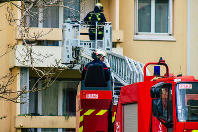 Rear view of man standing outside building