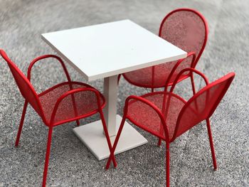 High angle view of empty chair on table