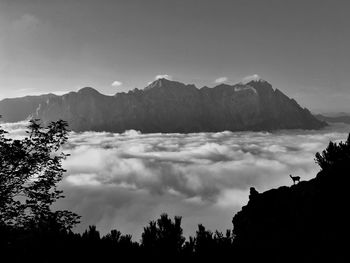 Scenic view of silhouette mountains against sky