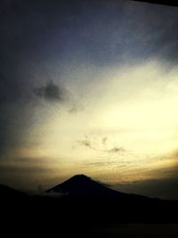 Scenic view of mountains against sky at sunset