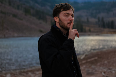 Portrait of young man looking away