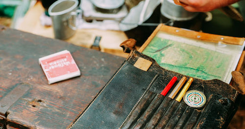 Midsection of man working on table