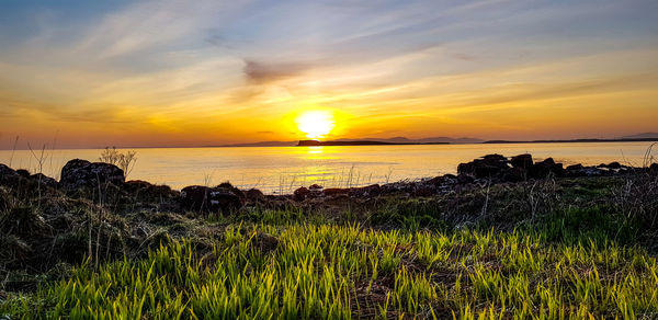 Scenic view of sea against sky during sunset