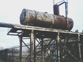 Low angle view of metal structure against sky