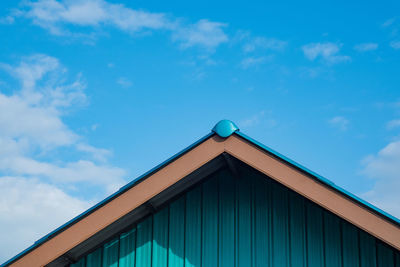 Low angle view of building against blue sky