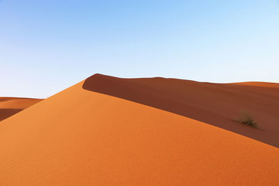 Scenic view of desert against clear sky