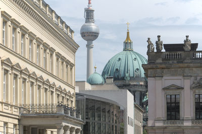Fernsehturm and berlin cathedral amidst buildings