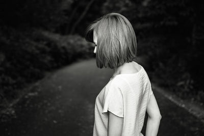 Rear view of woman standing outdoors