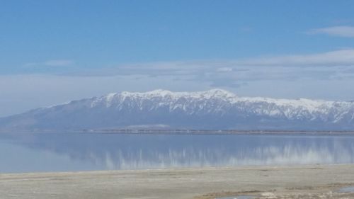 Scenic view of lake with mountains in background