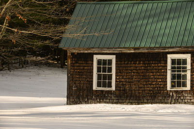 An old small barn on a sunny winter day