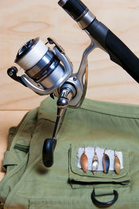 Close-up of fishing equipment on table