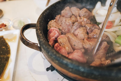 High angle view of meat in container on table