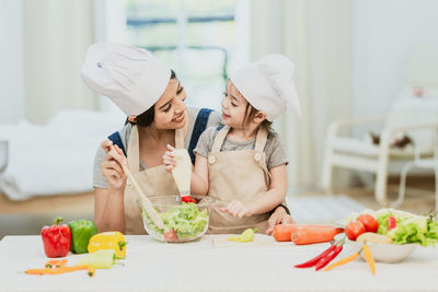 Midsection of woman preparing food