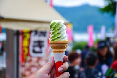 Close-up of hand holding ice cream