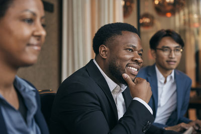 Side view of business colleagues working at office