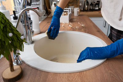 High angle view of man washing hands