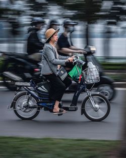 Man riding bicycle on street