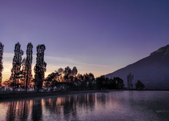 Scenic view of lake against sky during sunset