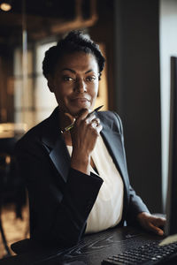 Confident portrait of mature businesswoman at office