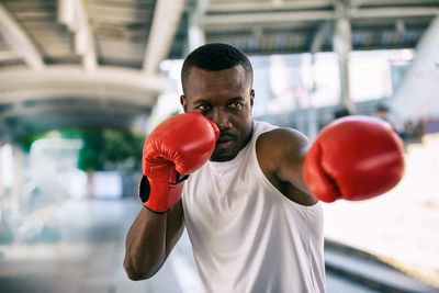 Man boxing while standing outdoors