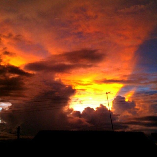 sunset, silhouette, sky, orange color, beauty in nature, scenics, cloud - sky, tranquility, tranquil scene, dramatic sky, low angle view, nature, idyllic, cloud, cloudy, outline, landscape, outdoors, moody sky, majestic