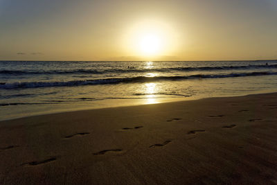 Scenic view of sea against clear sky during sunset