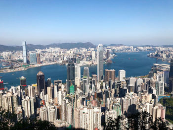 High angle view of city and buildings against clear sky