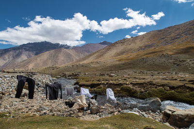 Scenic view of mountains against cloudy sky