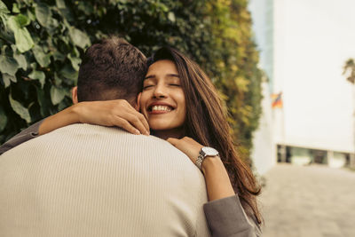 Portrait of young couple kissing