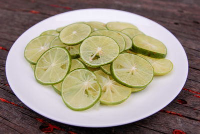 High angle view of fruits in plate on table