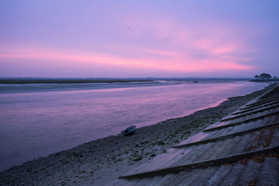 Scenic view of sea against sky at sunset