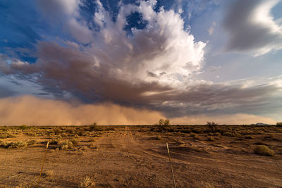 Scenic view of dramatic sky over landscape