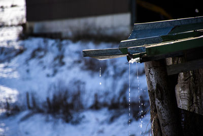 Close-up of icicles on metal during winter