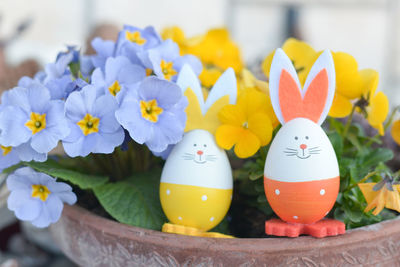 Close-up of colorful easter eggs toy in potted plant