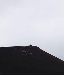 Low angle view of landscape against clear sky