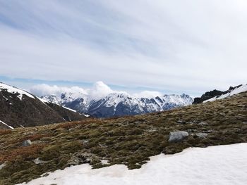 Scenic view of snowcapped mountains against sky