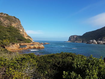 Scenic view of sea against clear blue sky