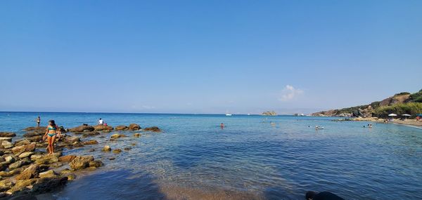 Scenic view of sea against clear blue sky