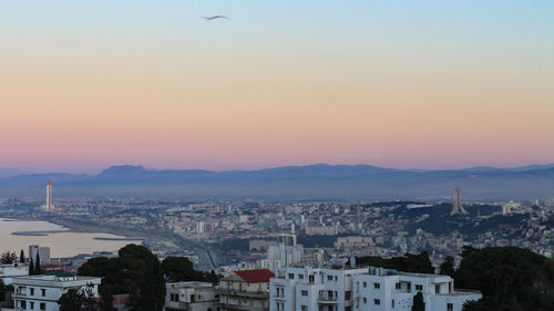 High angle view of townscape against sky during sunset