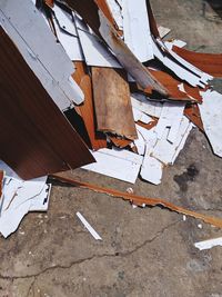 High angle view of broken on wooden floor