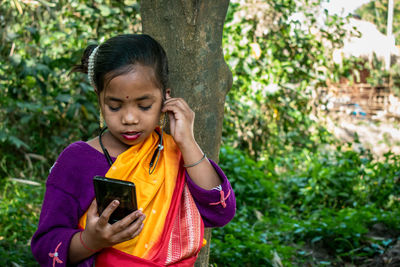 Young woman using mobile phone