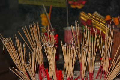 Close-up of lit candles in temple