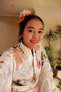 Portrait of smiling young woman in kimono