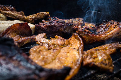 Close-up of meat on barbecue grill