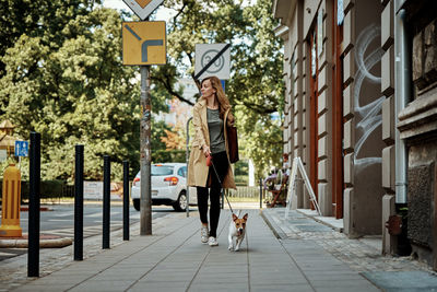 Woman walks with dog