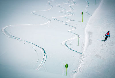 Person skiing on snow covered mountain