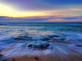 Scenic view of sea against sky during sunset