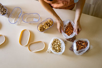 High angle view of woman preparing food on table